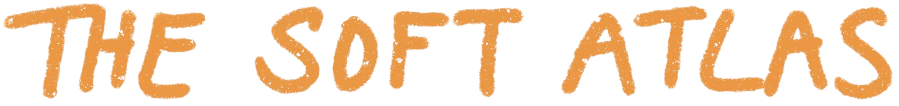 A orange logo with handwritten text for travel blog The Soft Atlas