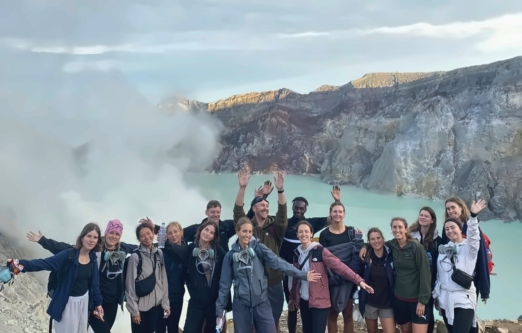 Aerial view of the turquoise sulphuric crater lake inside Mount Ijen East Java Indonesia with Mador Hostel tour group