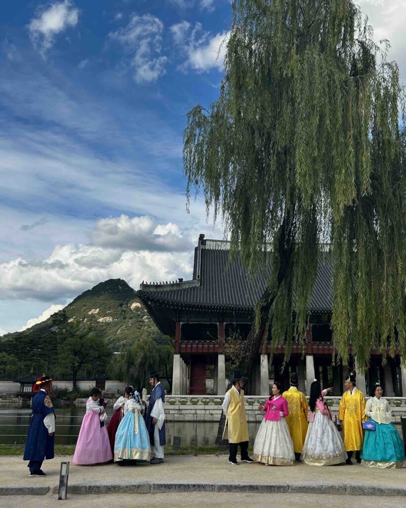 Visitors wearing traditional hanbok at Gyeongbokgung Palace in Seoul