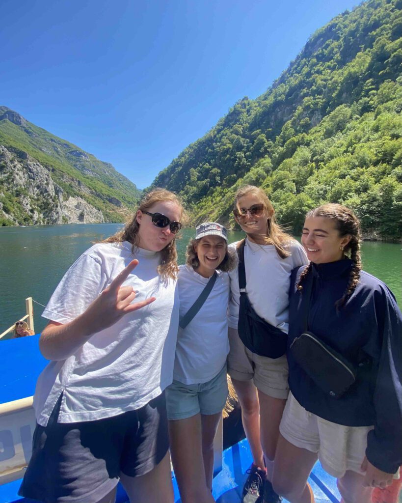 Backpackers from Wanderers Hostel travelling on the Komani Lake ferry before the Valbona to Theth hike