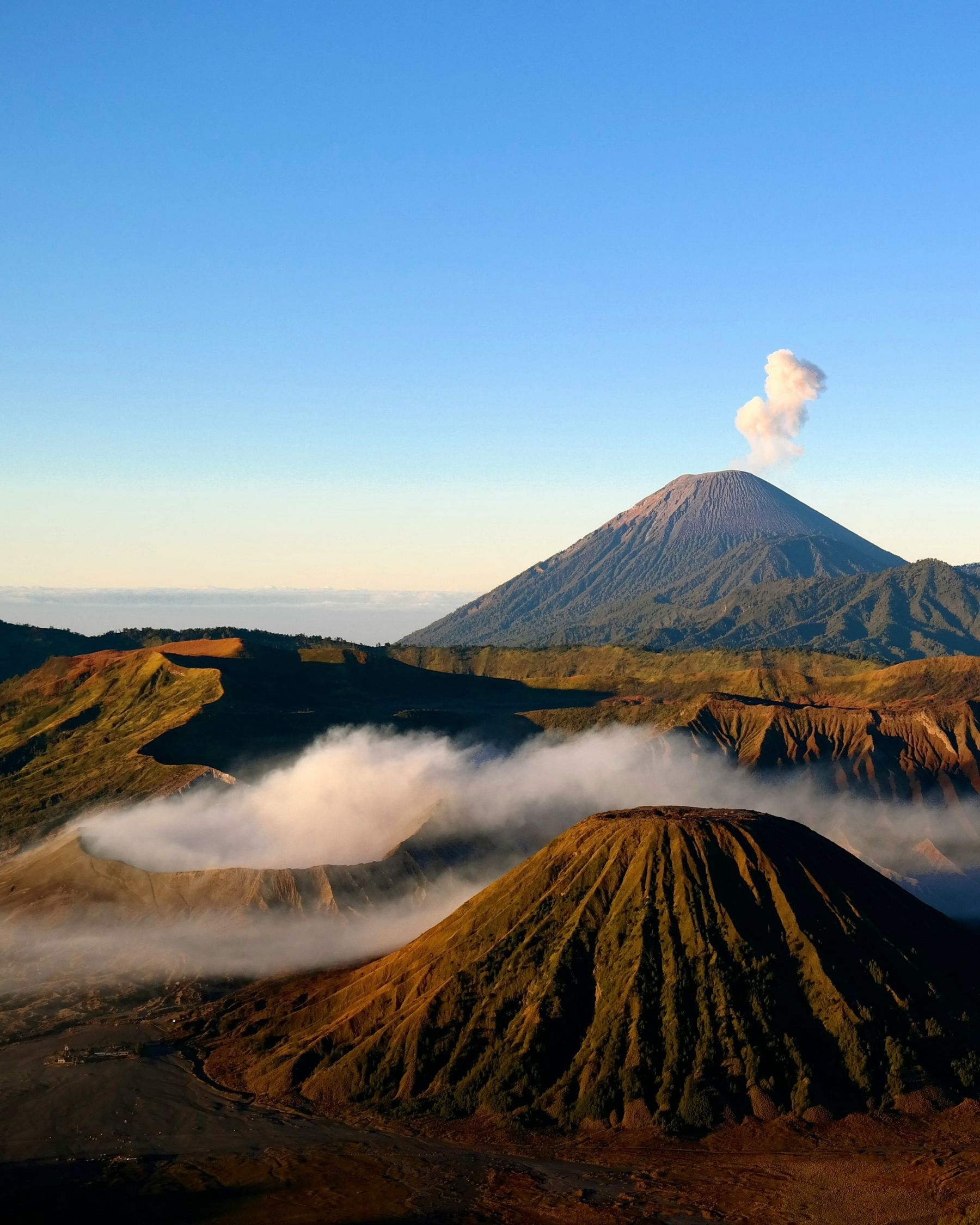 Mount Bromo volcano rising above the clouds at sunrise East Java Indonesia