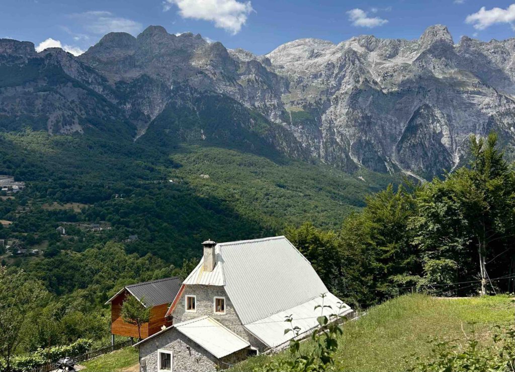 Traditional houses in Theth surrounded by the Albanian Alps