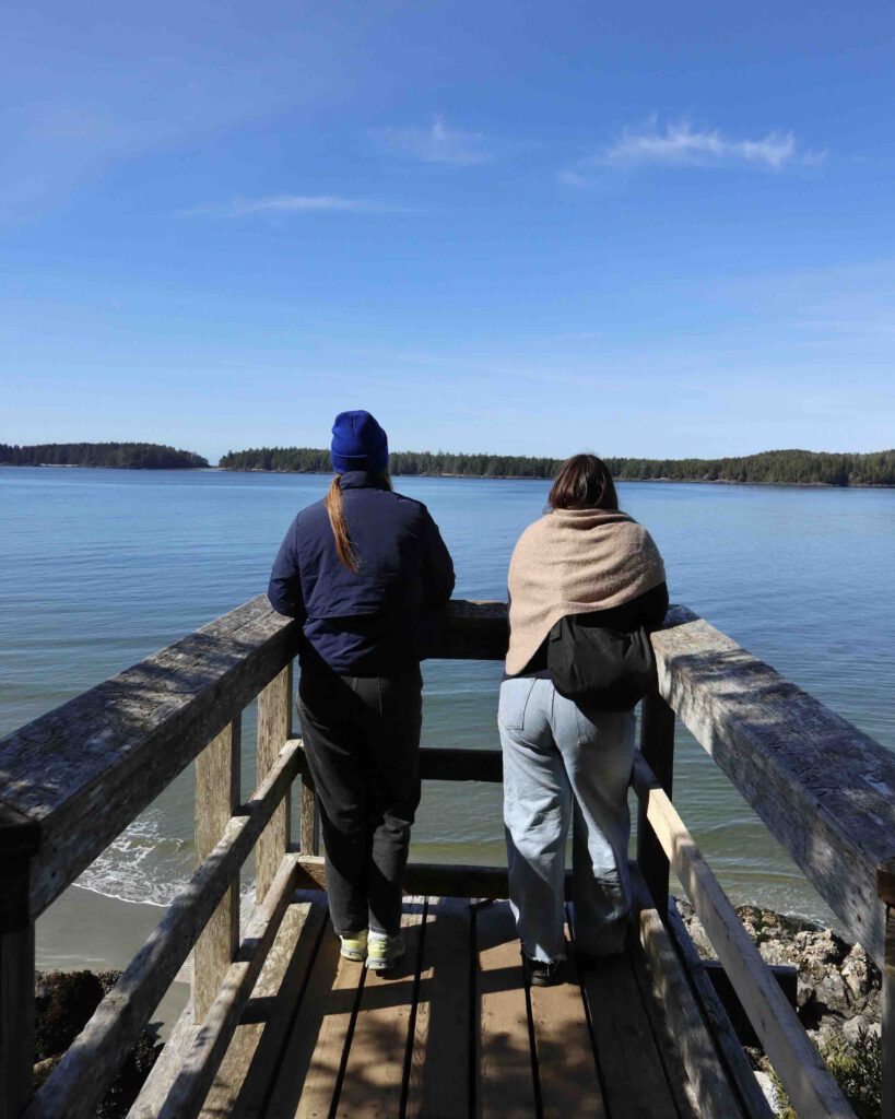 2 people at a lookout point on the Tonquin Trail coastal walk in Tofino in spring