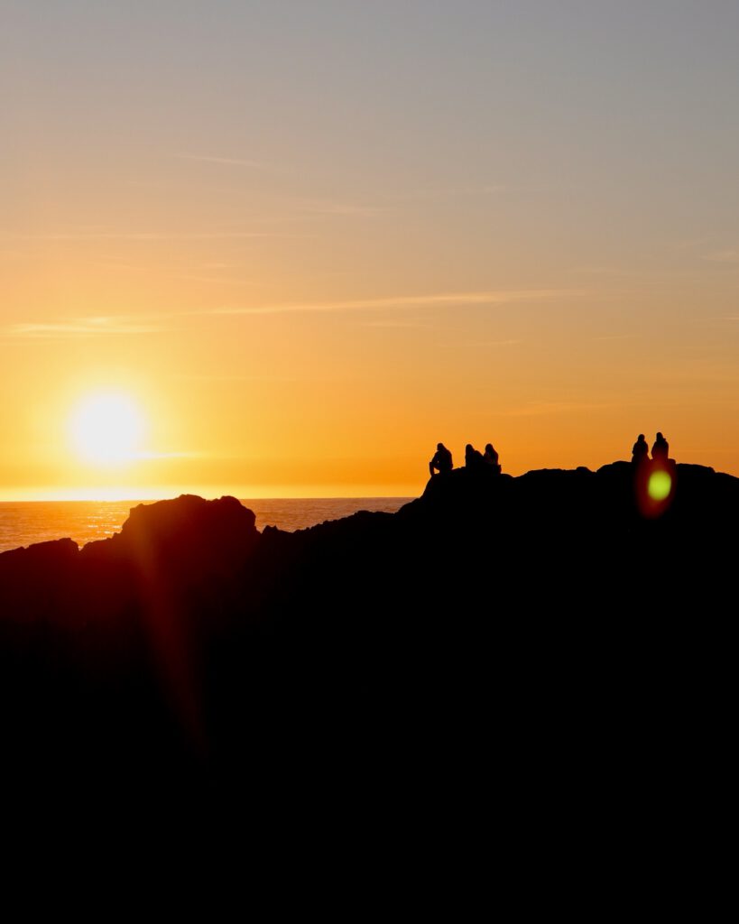 Stunning orange sunset over the Pacific Ocean from the Wild Pacific Trail in Ucluelet BC