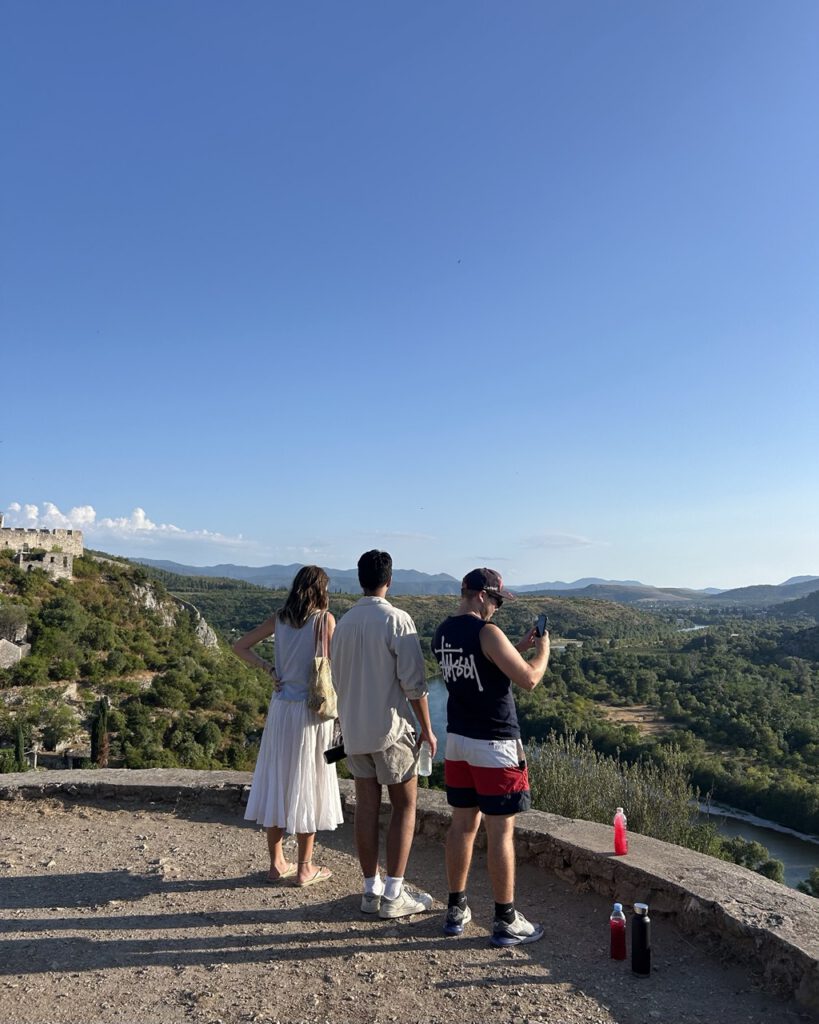 Backpackers on Bata's Crazy Tour in Mostar at a viewpoint overlooking Počitelj