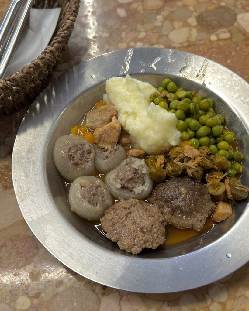 Traditional Bosnian meal with dolma and meatballs at a ascinicas