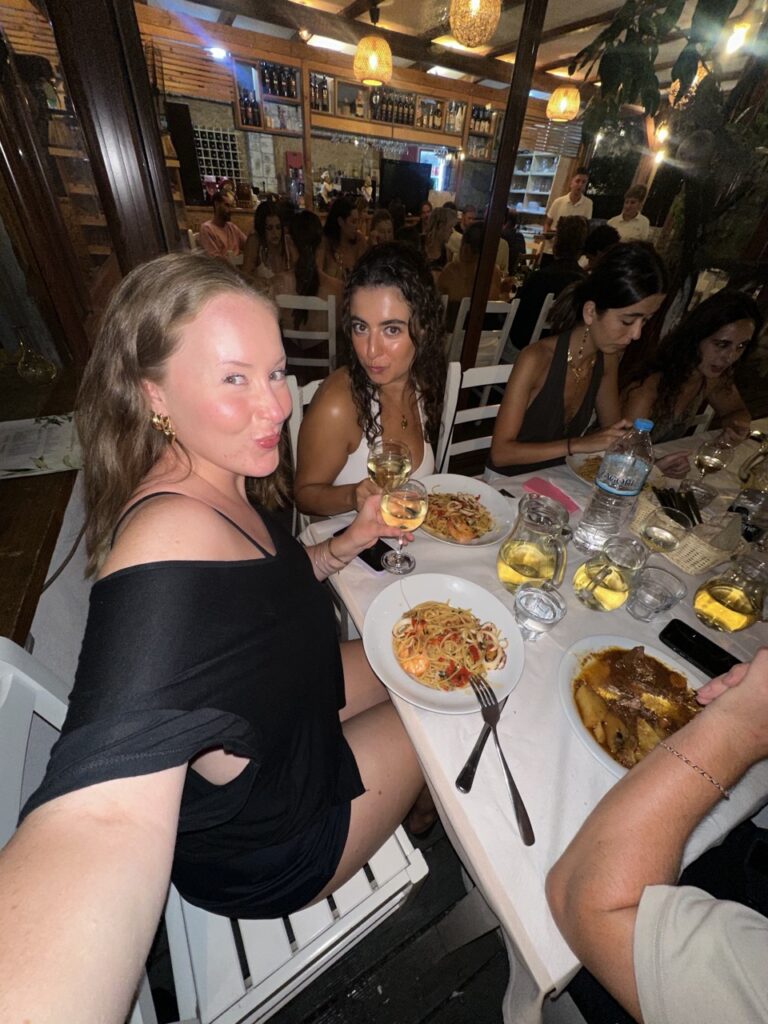 Group dinner with fellow backpackers in Himarë, Albania